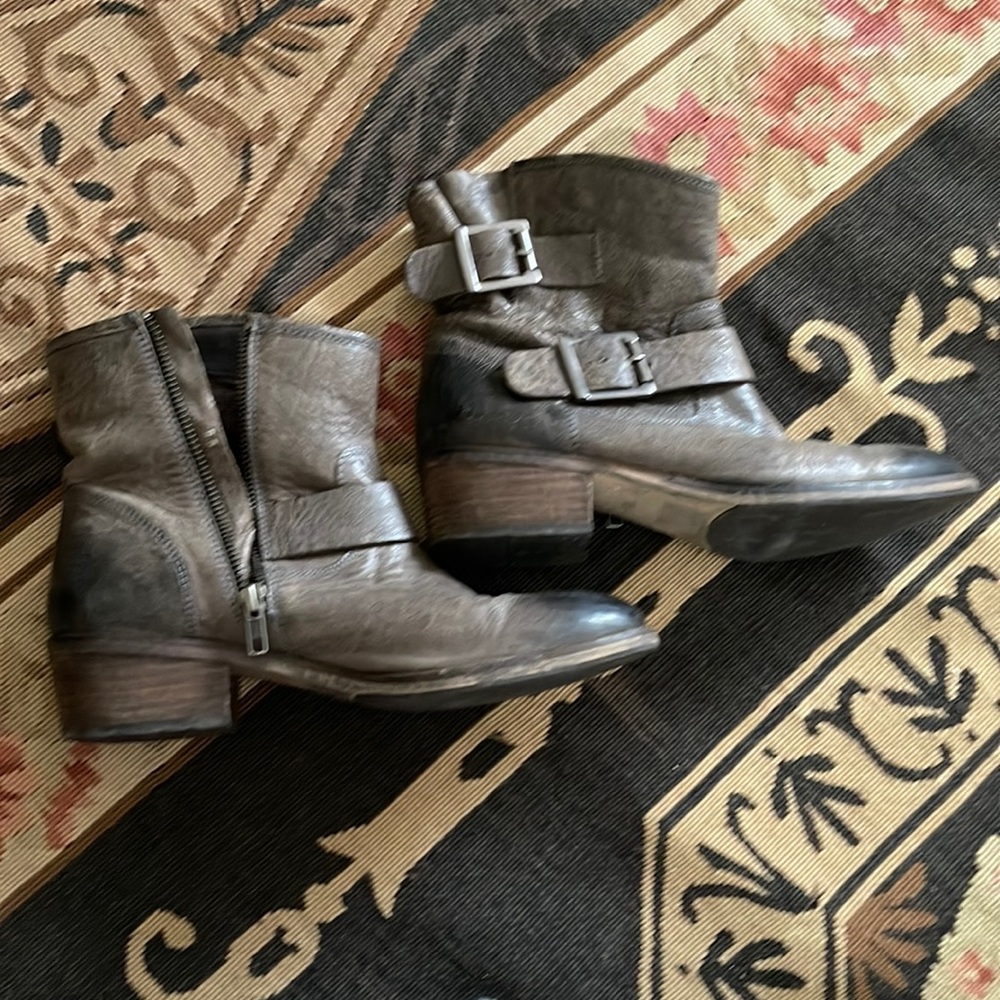 Seychelles leather bootie with zip up side . Low heel . Buckle accents .
